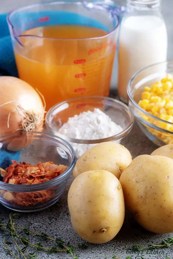 The corn chowder ingredients like potatoes, bacon, and onions.