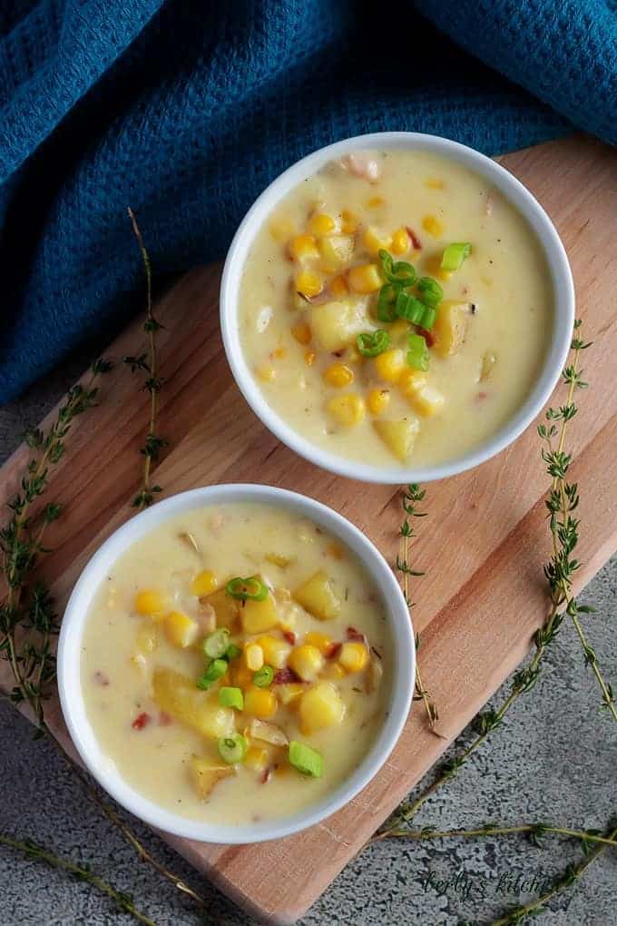 A top-down shot of the corn chowder with bacon, topped with diced green onions.