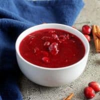 Close-up picture of the homemade cranberry sauce with vodka in a white bowl.
