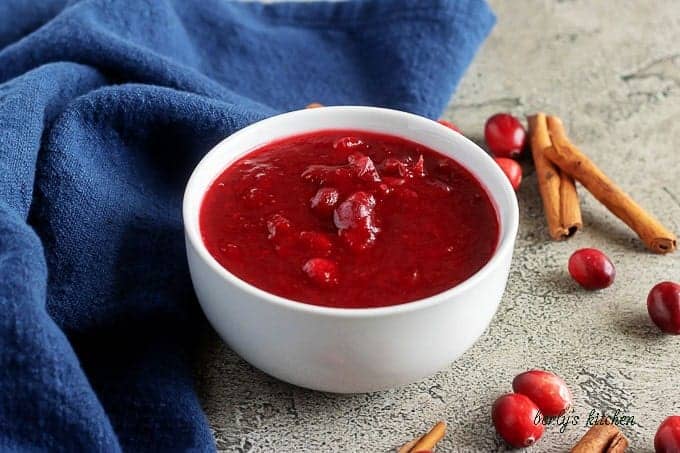 Close-up picture of the homemade cranberry sauce with vodka in a white bowl.