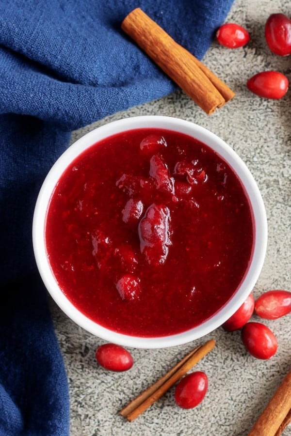 A large top-down picture of the finished homemade cranberry sauce served in a white bowl.