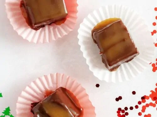 Top down view of three pieces of bourbon caramel fudge.