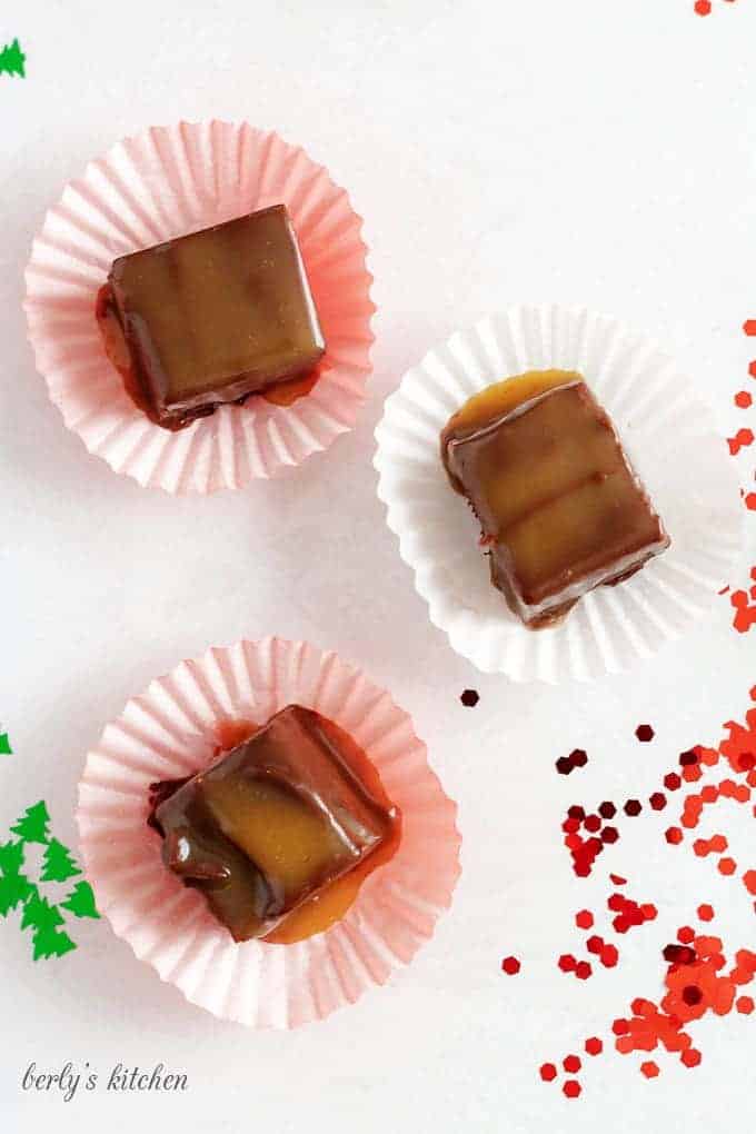 Top down view of three pieces of bourbon caramel fudge.