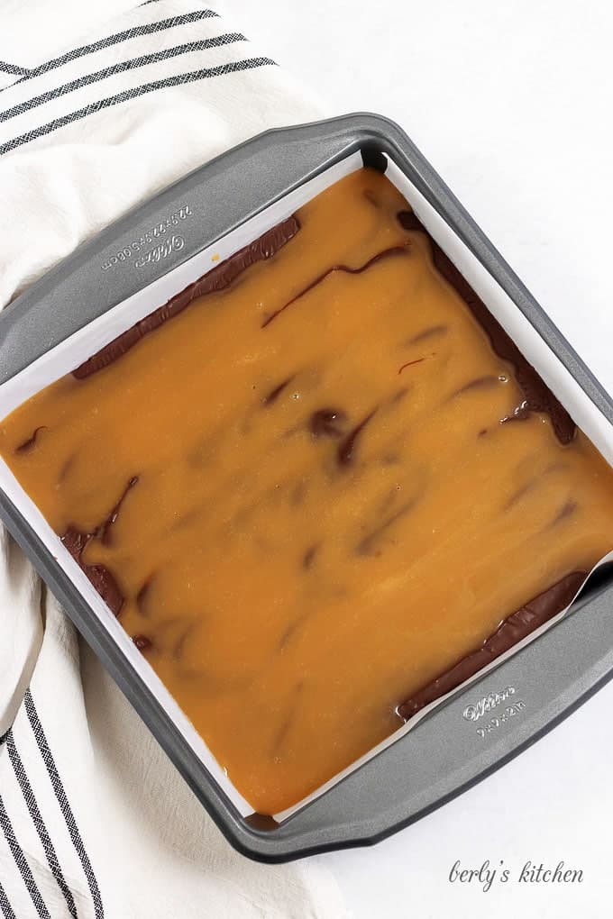 Top down view of bourbon caramel fudge in a baking dish.