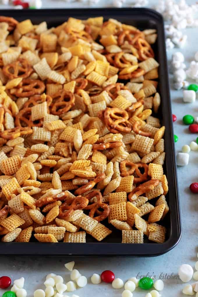 Christmas chex mix on a baking sheet.