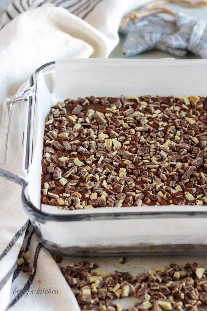 The mint fudge, transferred to a pan and topped with mint candy.