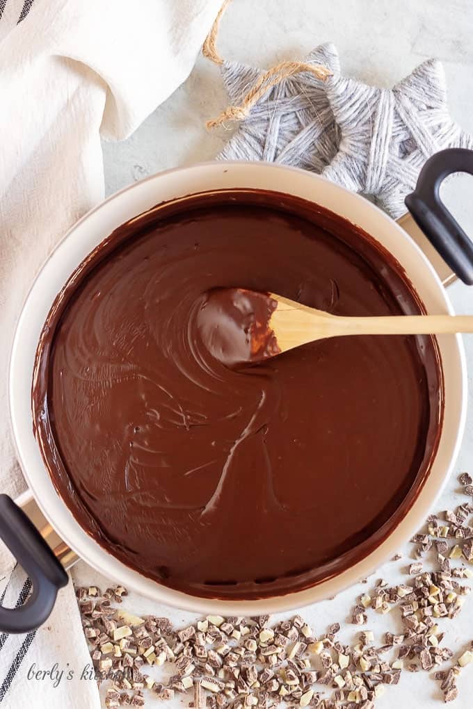 An aerial view of the melted chocolate and milk in a pan.