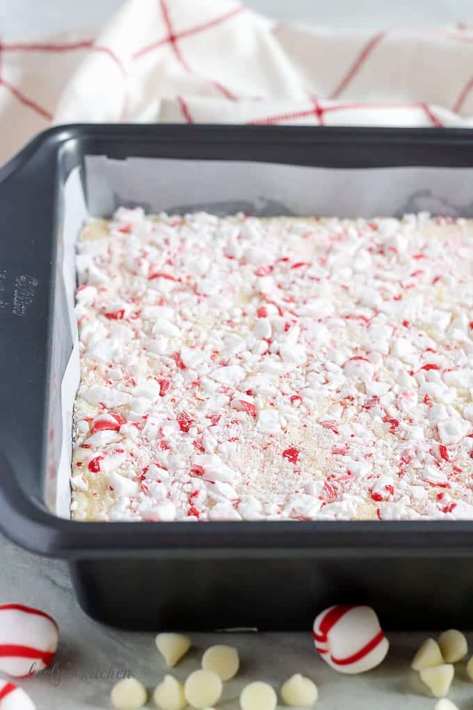 The hot fudge has been transferred to a dish and covered with peppermint candy.