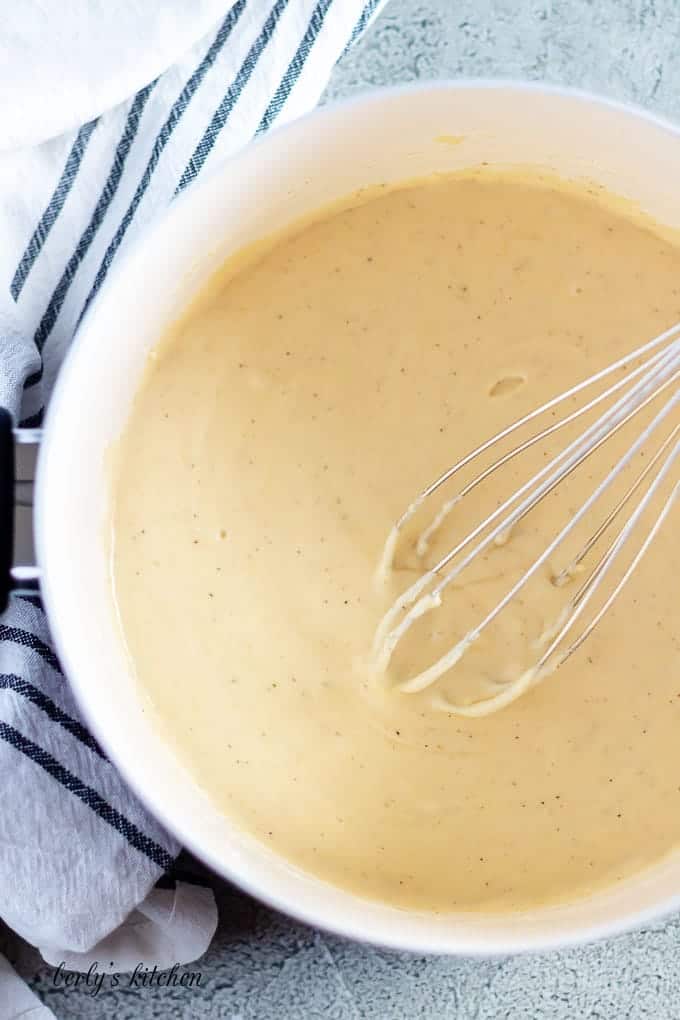 A top-down view of the creamy Alfredo sauce as it cooks.