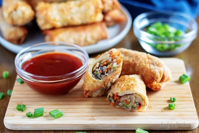 The golden brown egg rolls, served with sweet and sour sauce.