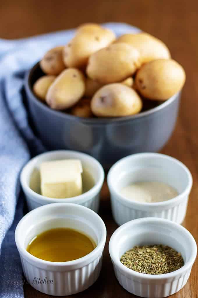 The baby potatoes ingredients, like butter, seasonings, and olive oil.