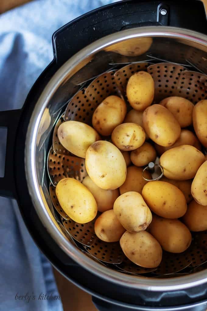 An aerial view of the baby potatoes in the pressure cooker.