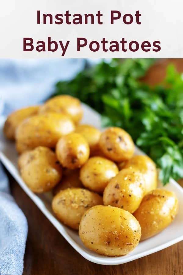 Large picture of the baby potatoes on a serving dish, with herbs.