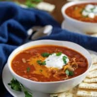 Large photo of the instant pot chili topped cheese and sour cream.