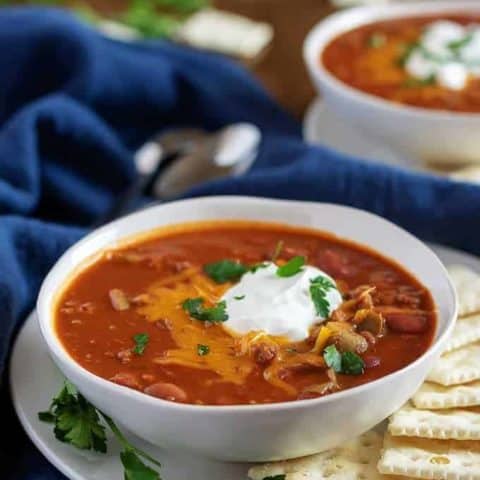 Large photo of the Instant Pot chili topped cheese and sour cream.