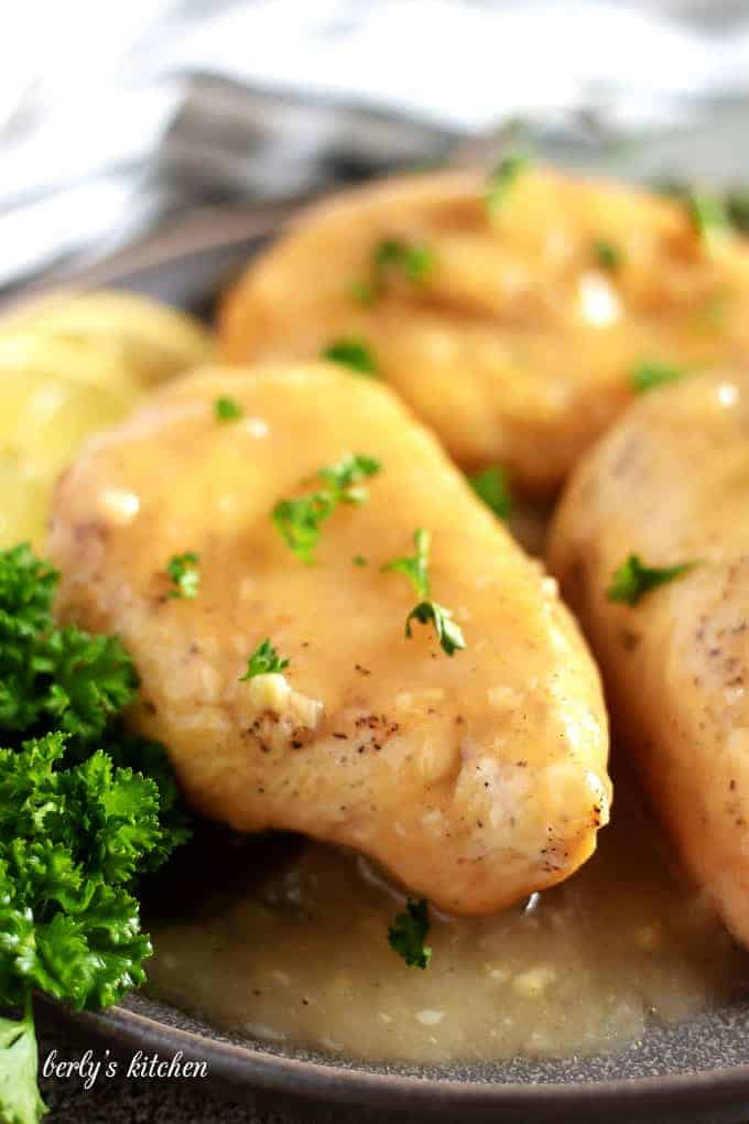 A close-up shot of the finished chicken breasts smothered in sauce.