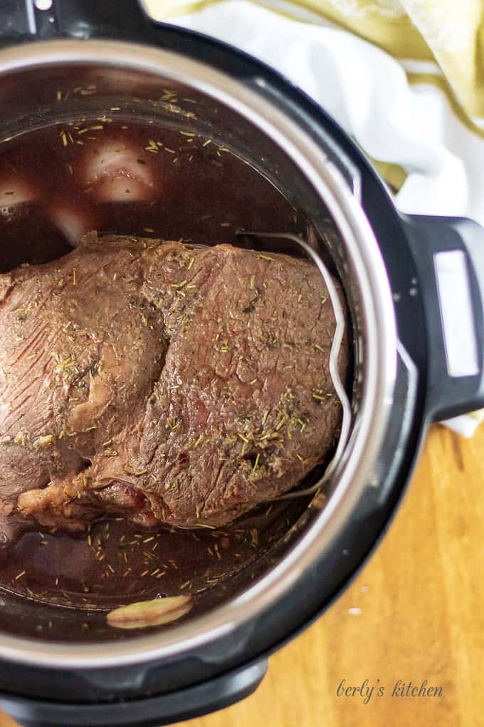 An aerial view of the finished pot roast in the pressure cooker.