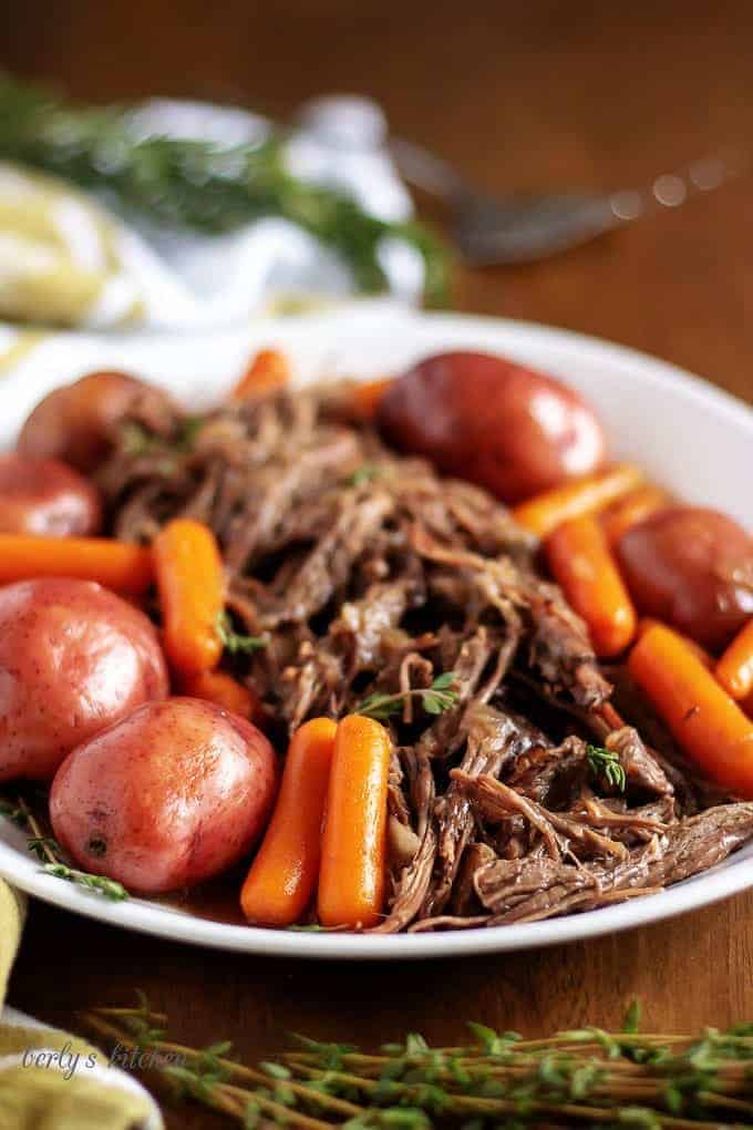 A final photo of the roast on a white platter for serving.