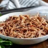 A small serving dish filled with the Instant Pot pulled pork.