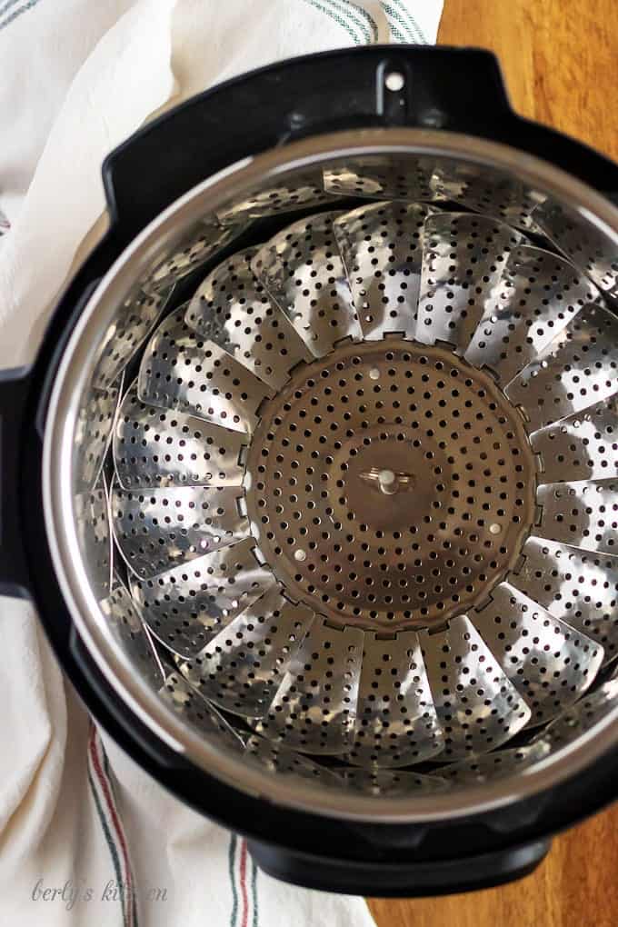 A top-down photo of the steamer basket in the pressure cooker.