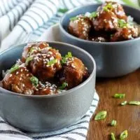 Two bowls of Instant Pot Teriyaki Meatballs with rice.