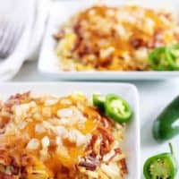 Large photo of the hash browns, smothered in chili and shredded cheese.