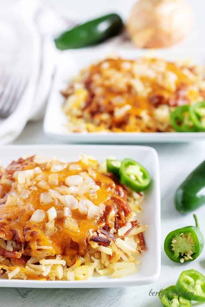 Large photo of the hash browns, smothered in chili and shredded cheese.