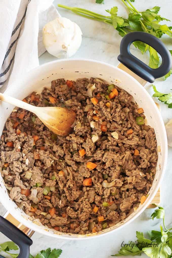 An aerial view of the beef, onions, carrots, and celery cooking.