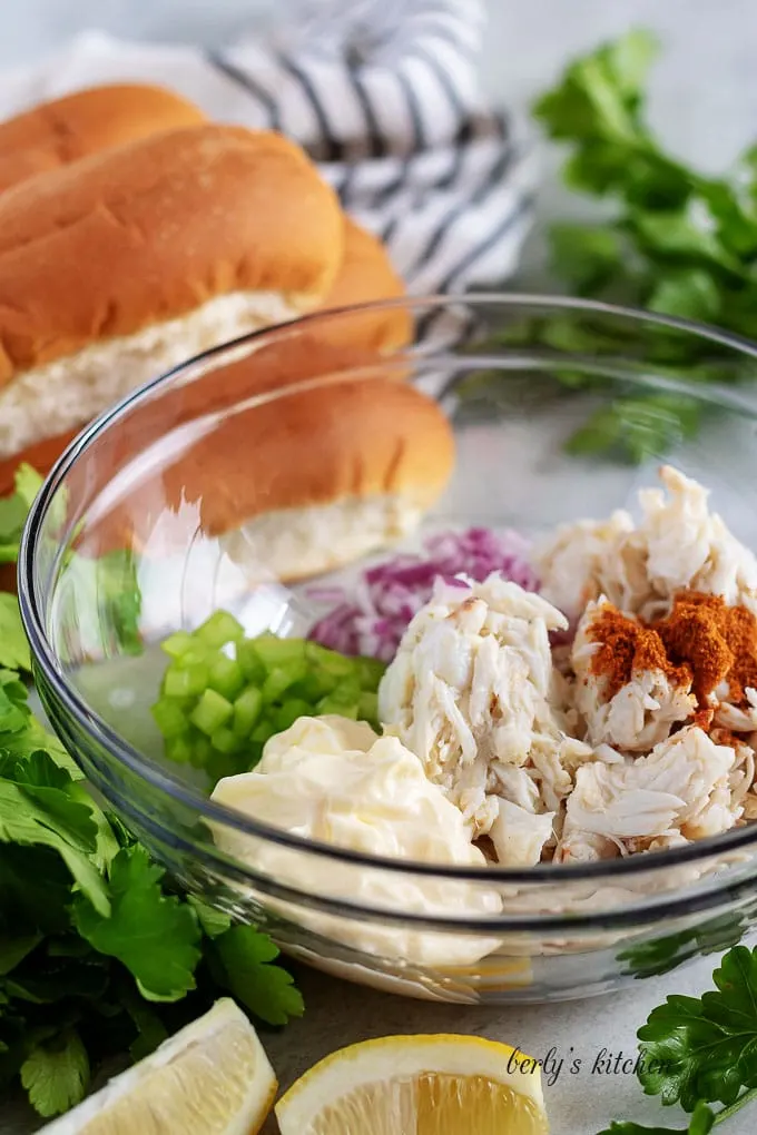 All of the crab roll ingredients placed into a large mixing bowl.