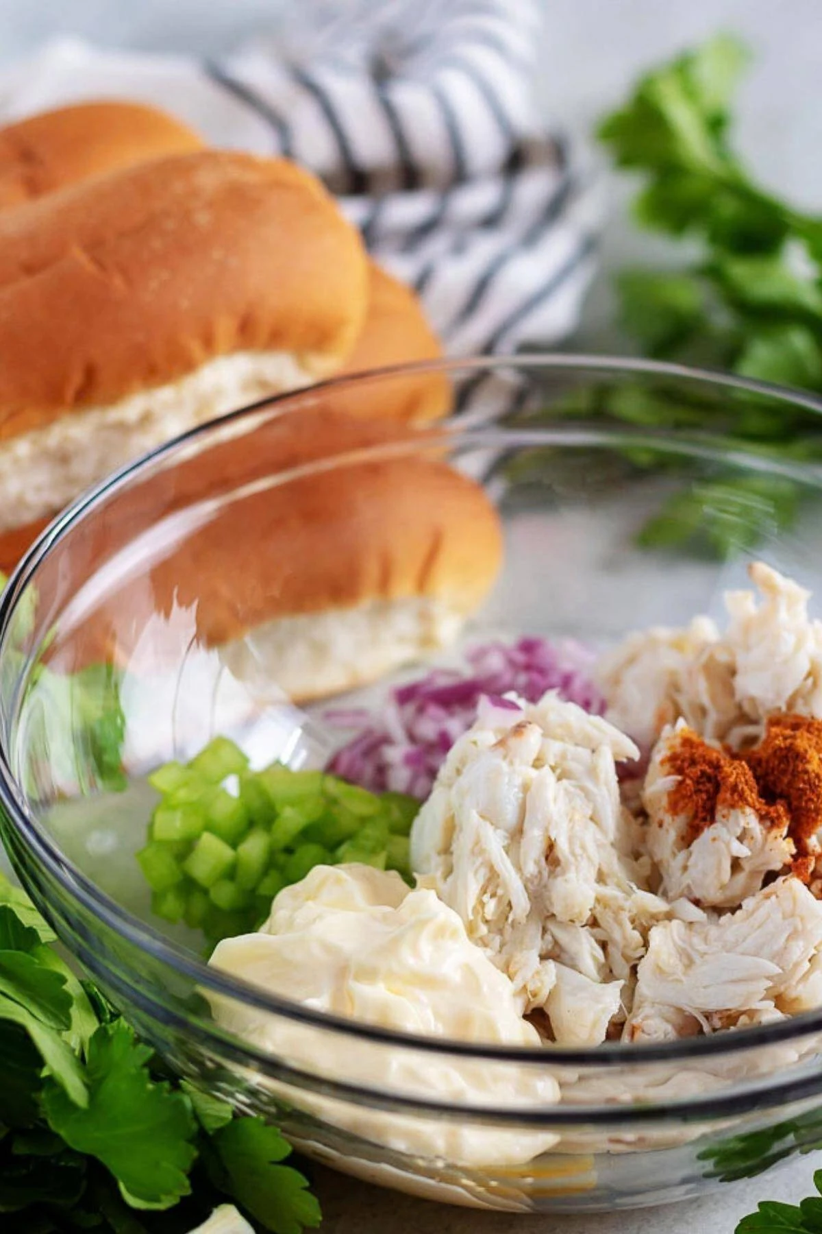 All of the crab roll ingredients placed into a large mixing bowl.