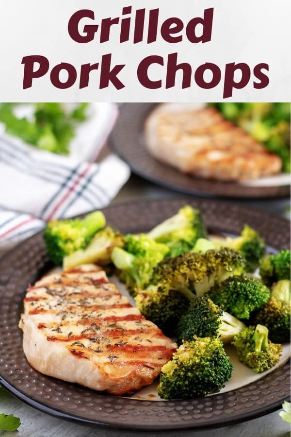The finished grilled pork chops with a side of sauteed broccoli.