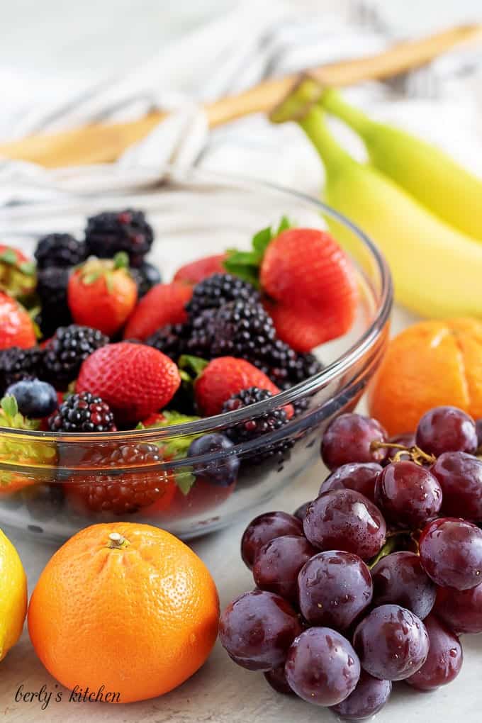 An ingredient picture showing the blackberries, blueberries, grapes, and other fruit.