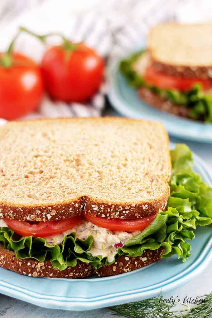 The finished sandwich, on whole wheat bread, with lettuce and tomato.