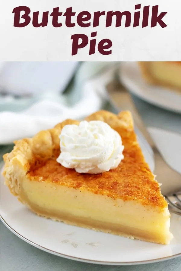 A large slice of buttermilk pie topped with whipped cream.