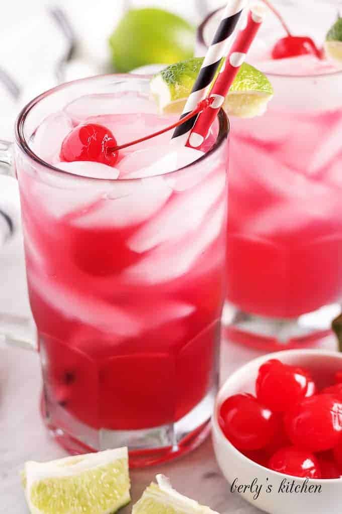 The drink served in a large mug with a colorful straw.