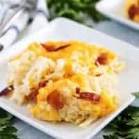 A portion of the hash brown casserole on a square plate.