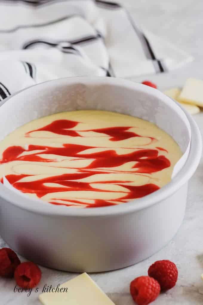 Instant Pot White Chocolate Raspberry Cheesecake in a pan.