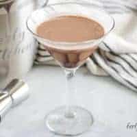 The double chocolate martini in a martini glass with a chocolate drizzle.