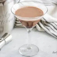 The double chocolate martini in a martini glass with a chocolate drizzle.