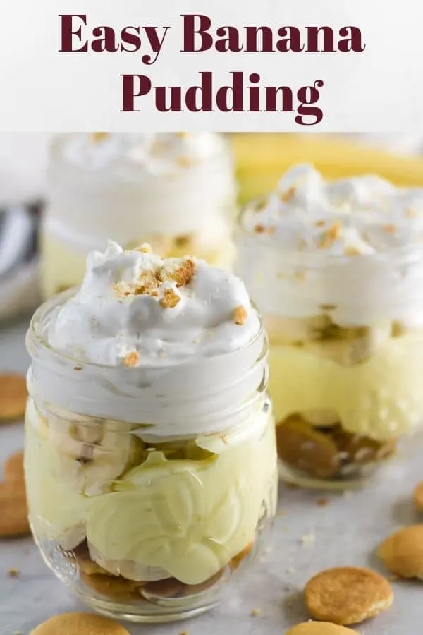 Easy banana pudding served in decorative mason jars garnished with crumbled wafers.