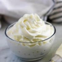 Large photo of the finished homemade whipped cream in a ramekin.