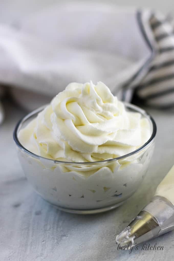 Large photo of the finished homemade whipped cream in a ramekin.