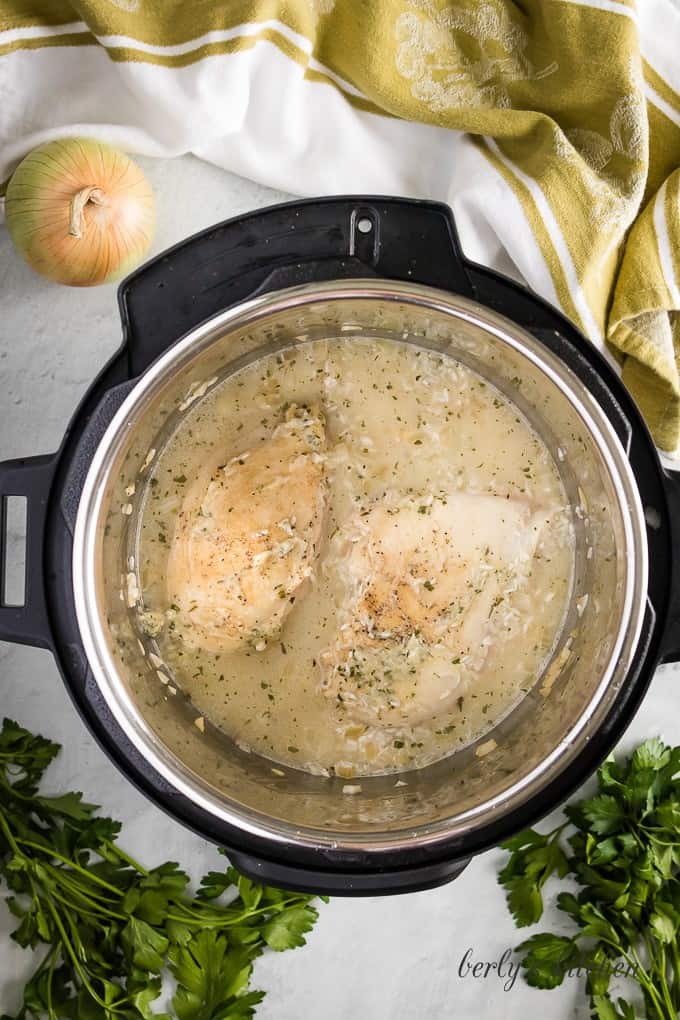 Now chicken broth has been poured into the instant pot.