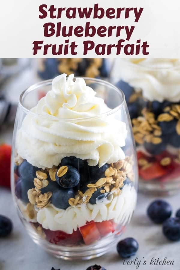 Large photo of the finished strawberry blueberry parfaits in stemless wine glasses.