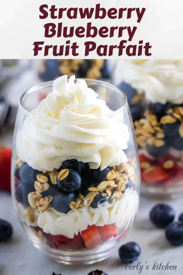 Large photo of the finished strawberry blueberry parfaits in stemless wine glasses.