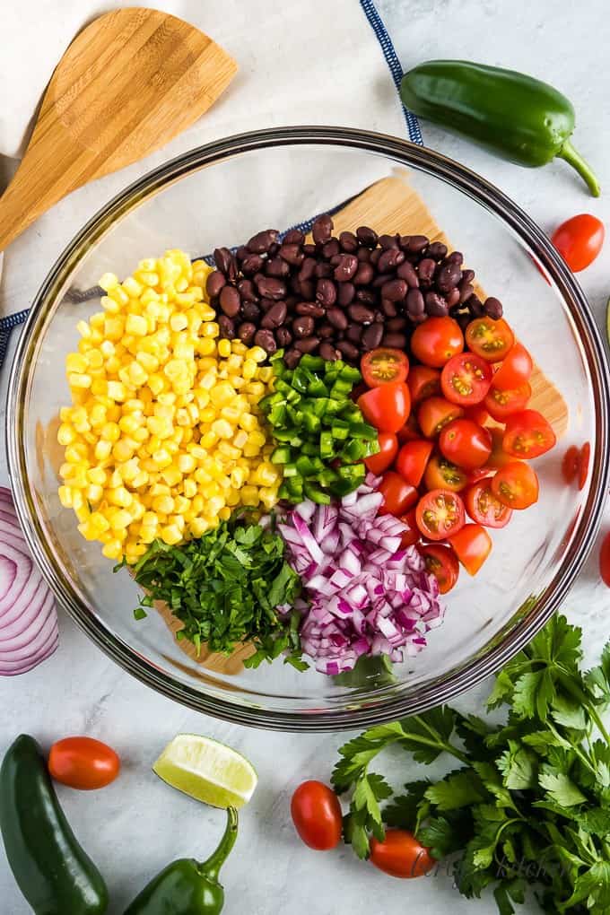 An aerial view of the corn and other ingredients in a bowl.