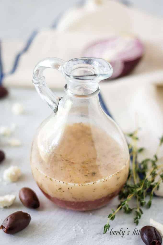 The salad dressing sitting in a dressing bottle ready to be poured.