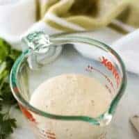 Activated yeast in a measuring cup.