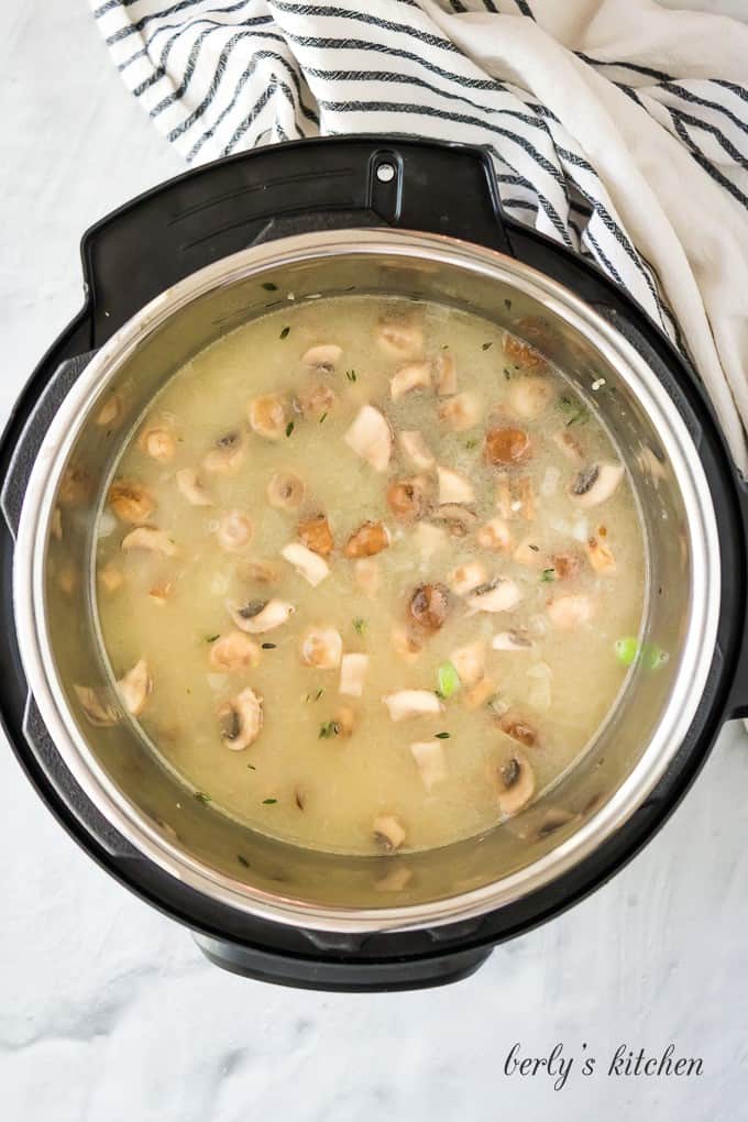 Broth and peas have been added just before sealing the cooker.