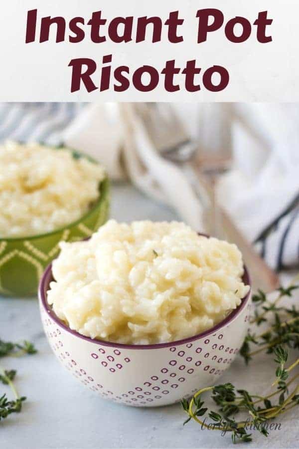 A decorative bowl filled with instant pot risotto surrounded by herbs.